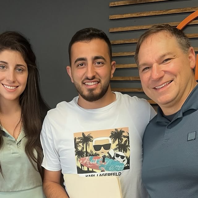 Patricia Elhachem with clients after a closing